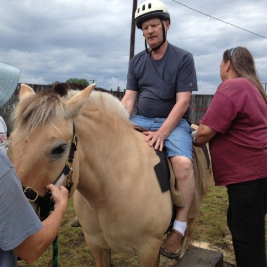 Dad riding a horse